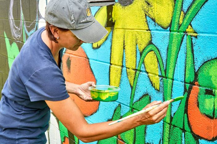 upclose painting mural for Village of Spring Lake.